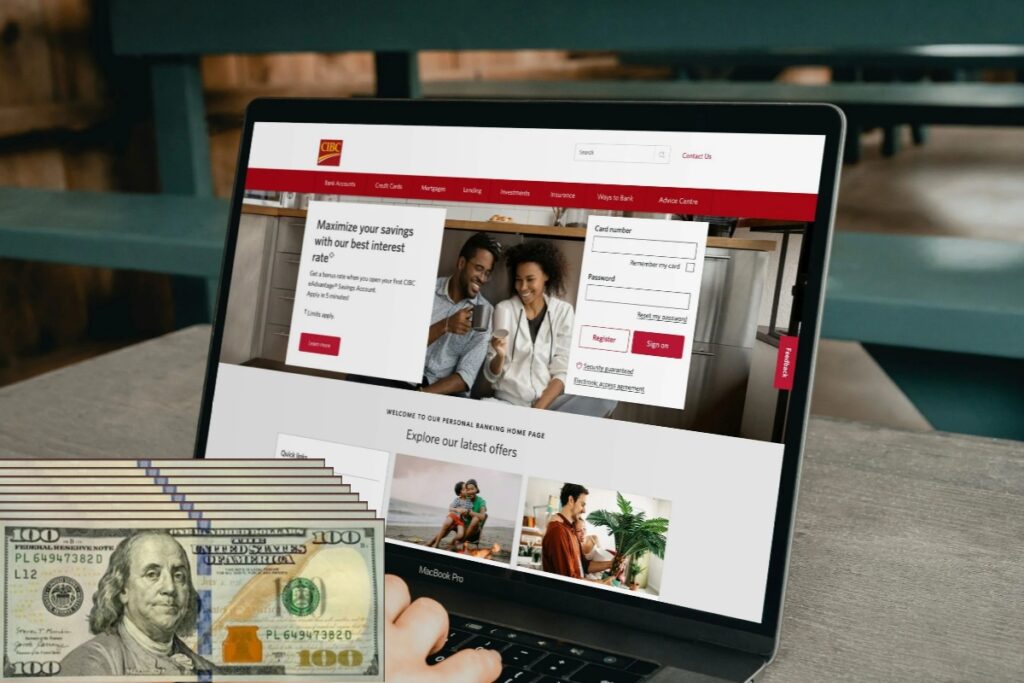 Laptop z widoczną stroną internetową oraz pliki banknotów na pierwszym planie, symbol kosztu stworzenia profesjonalnej strony WWW